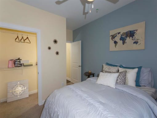 a bedroom with a bed and a closet