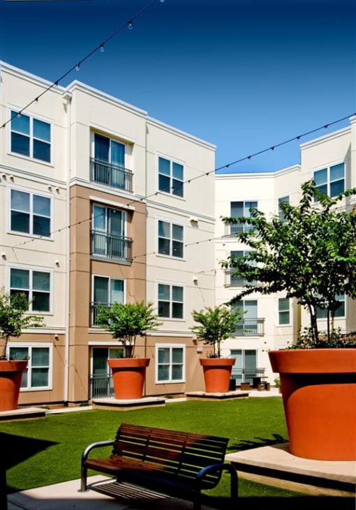 a bench in front of an apartment building
