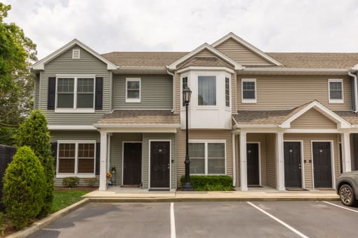 a house with a parking lot in front of it