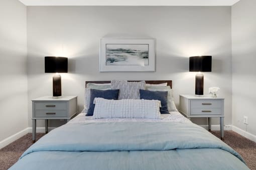a bedroom with a bed and two night stands at Stonewater Apartments, Louisville, KY 40241