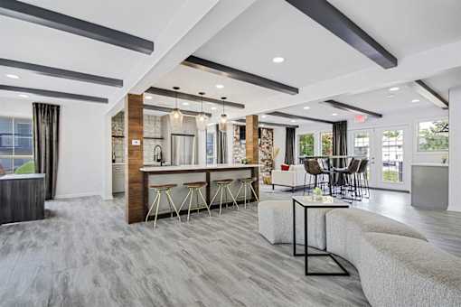 a resident lounge with couches chairs and a table at Southridge, Kansas City, KS, 66103