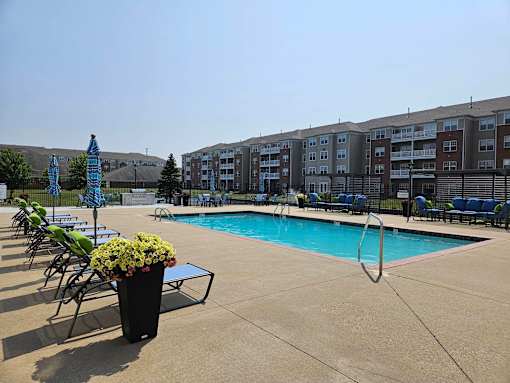 Pool With Relaxing Chairs at Vita on Grant, Merrillville Indiana