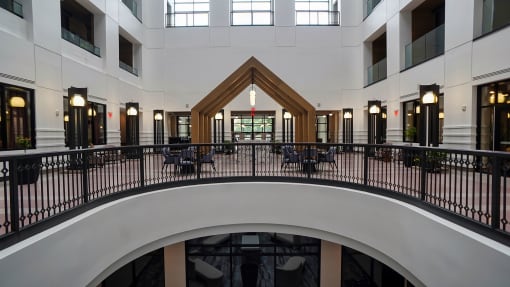 arium with tables and chairs in the middle of a building