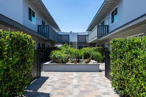 Courtyard with Paved Walkway at Eastside Haven at 17th Apartments, Costa Mesa, California