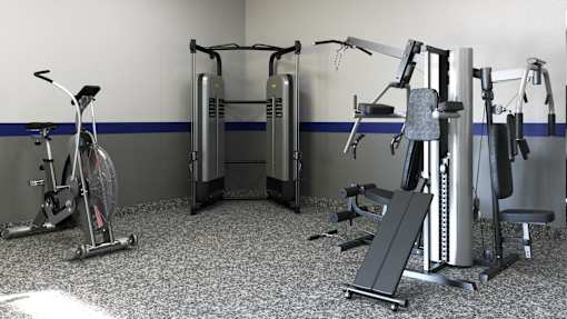 A gym with a variety of exercise equipment including a stationary bike, a leg press machine, and a chest press machine.