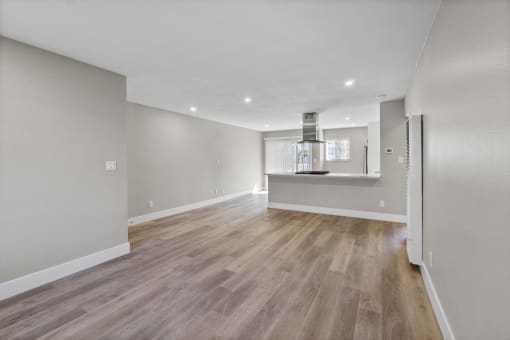 renovated kitchen and living room at Ocean Breeze Terrace Apartment, Huntington Beach, CA