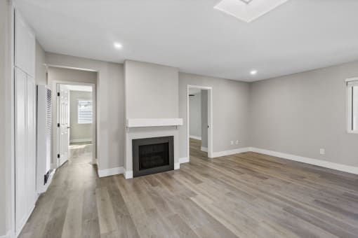 Living room with fireplace at Ocean Breeze Terrace Apartment, Huntington Beach, CA