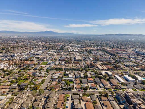 A cityscape with a clear blue sky above.