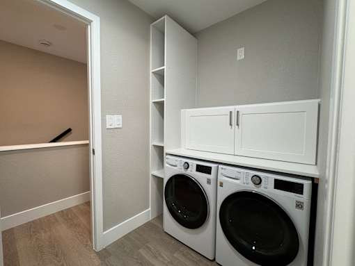 A laundry room with a washer and dryer.