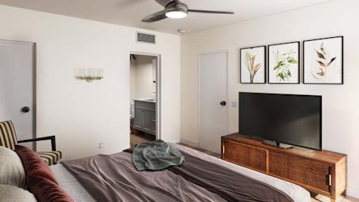 a bedroom with a bed and a tv
