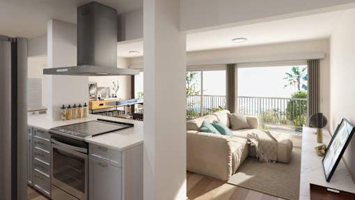 a living room with a kitchen and a couch