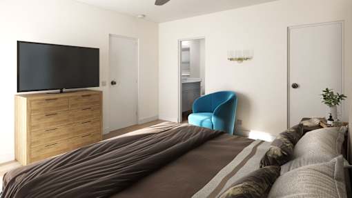 a bedroom with a bed and a television on a dresser
