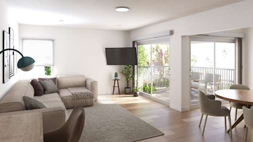 a living room with a couch and a table and a balcony