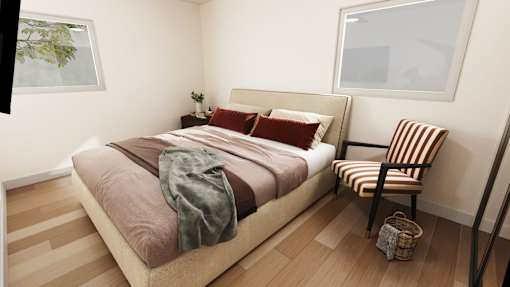 a bedroom with a bed and a chair and a window