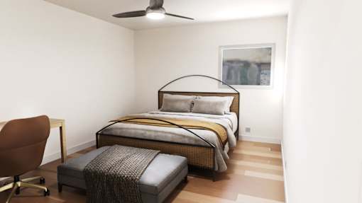 a bedroom with a bed and a ceiling fan