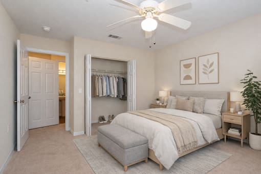 Bedroom with walk-in closet and ceiling fan at Walnut Ridge Apartments, North Carolina, 27610