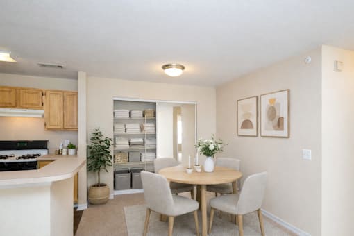Dining area with organized linen closet storage at Walnut Ridge Apartments, Raleigh, NC