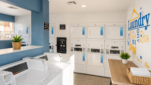 Onsite laundry facility with modern washers and dryers at Las Lomas Apartments, El Paso, TX 79912