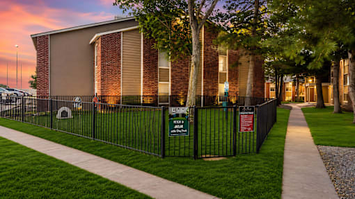 Fenced dog park with pet play area at Las Lomas Apartments, Texas, 79912