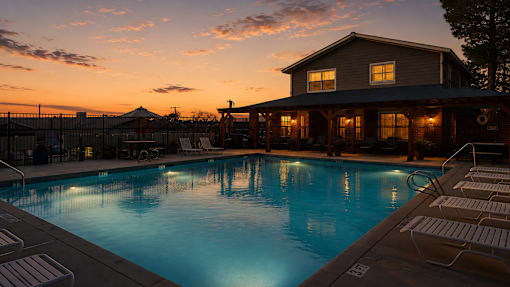 Resort style swimming pool with evening clubhouse at Las Lomas Apartments, El Paso, TX 79912