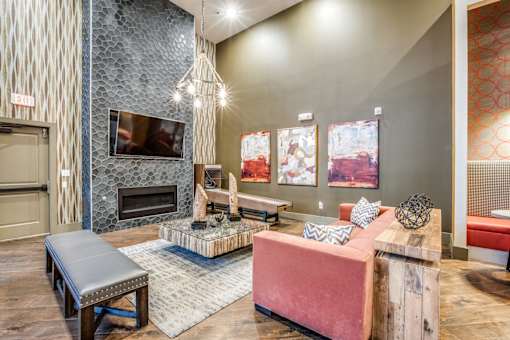 A living room with a fireplace and a television.
