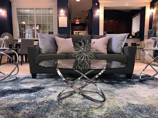 Contemporary living room with glass coffee table at Walnut Ridge Apartments, North Carolina, 27610