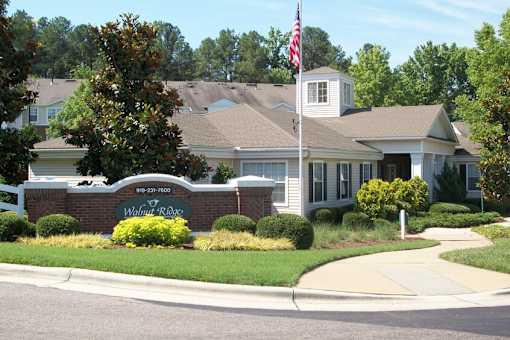 Brick monument sign with community name and landscaping at Walnut Ridge Apartments, Raleigh, NC 27610