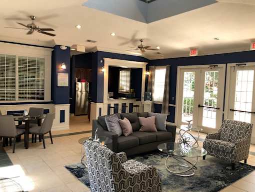 Community clubhouse with lounge and dining areas at Walnut Ridge Apartments, Raleigh, NC 27610