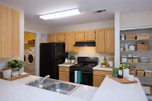 Kitchen with gas stove and open shelving at Walnut Ridge Apartments, Raleigh, NC
