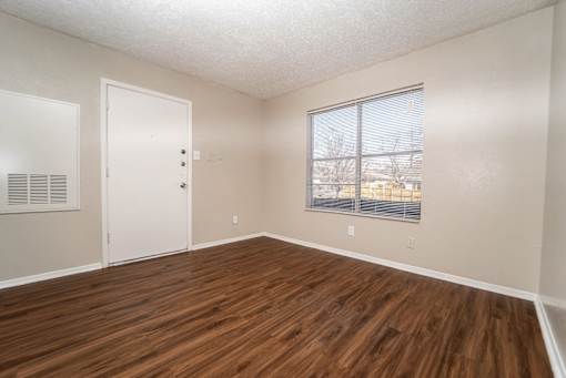 Bright unfurnished room with entry door at The Finley Apartments, Texas, 75228