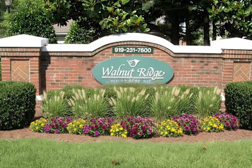 Property entrance sign with landscaping at Walnut Ridge Apartments, Raleigh, North Carolina