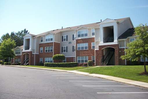 Three story apartment building with exterior stairways at Walnut Ridge Apartments, North Carolina
