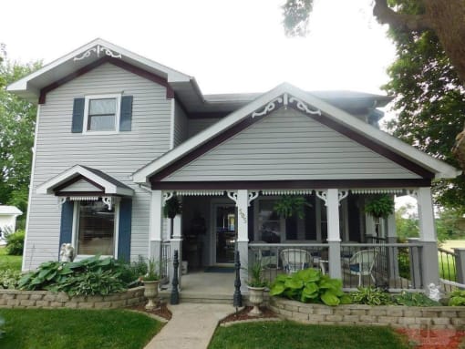 a house with a porch and a porch swing