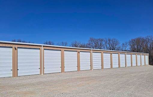 A long row of storage units with closed doors.