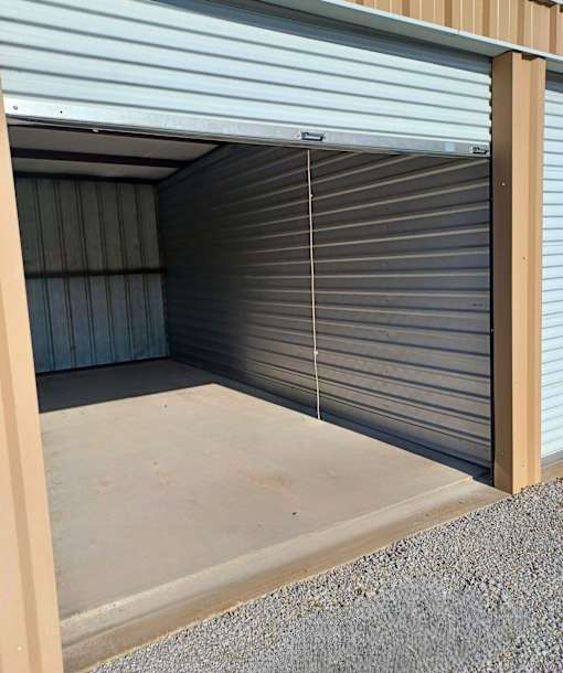 A closed grey garage door with a wooden frame.