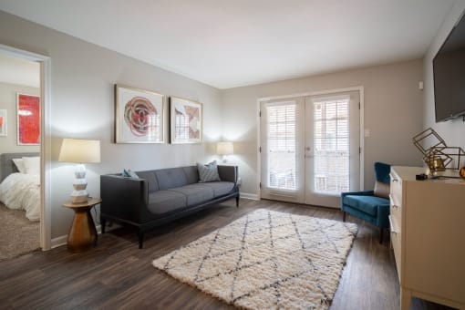 a living room with a couch and a chair