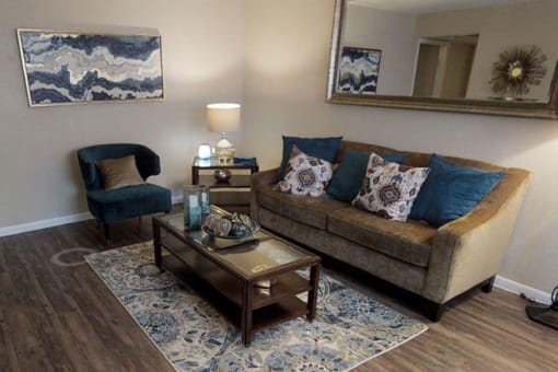 a living room with a couch and a chair