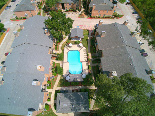 arial view of a house with a large swimming pool