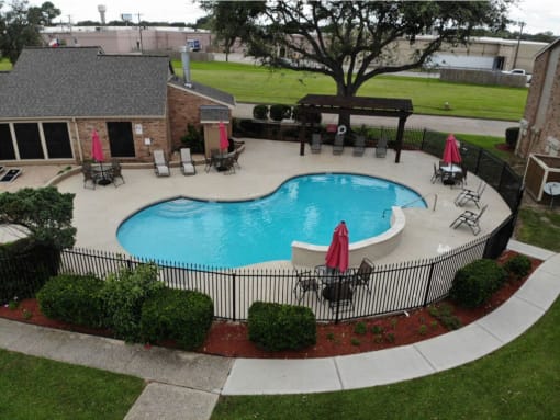 an above ground pool with a fence around it
