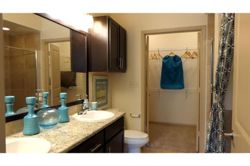 a bathroom with a toilet sink and shower