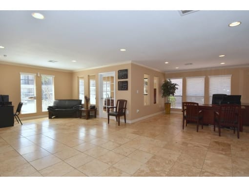 a large living room with a large tile floor
