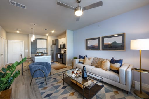 a living room and kitchen in a two bedroom apartment