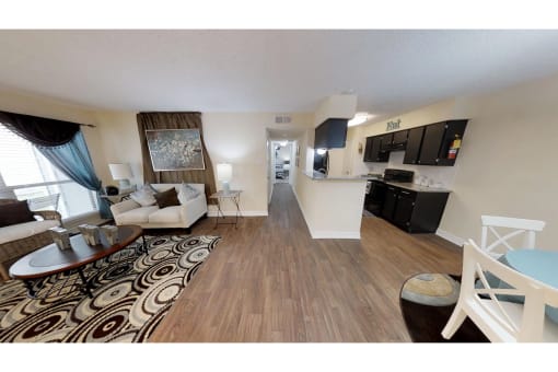 an open floor plan with a kitchen and living room