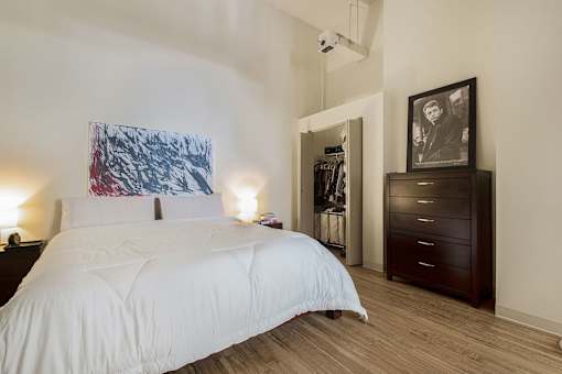 Denver Building Housing Furnished Bedroom Featuring High Ceilings