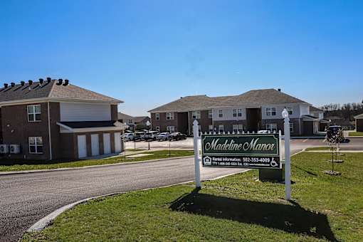 a welcome sign in front of a house