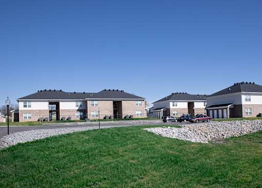 a group of houses on the side of a road