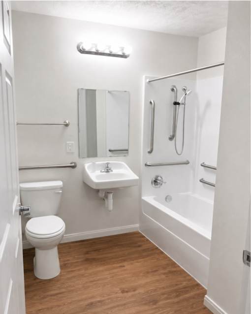 A white bathroom with a toilet, sink, and bathtub.