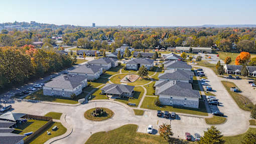 A large building complex surrounded by a parking lot.