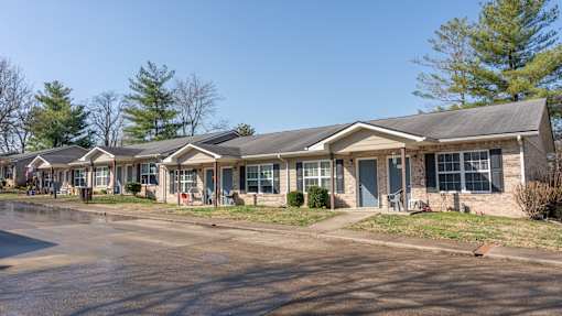 A row of houses with a clear blue sky above them.
