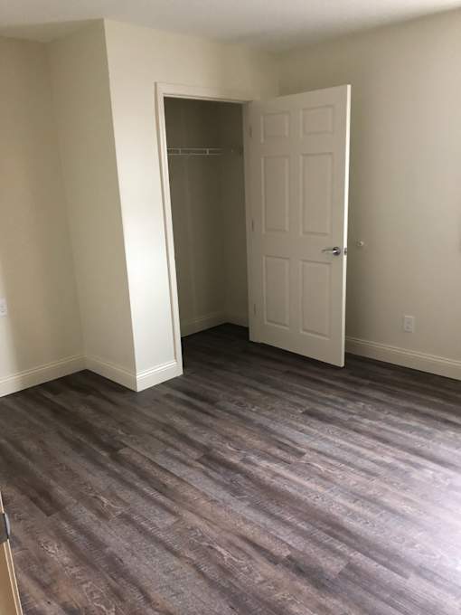 A room with a door and a wall.